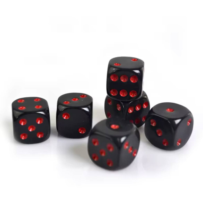 Set de dados negros con punto rojo